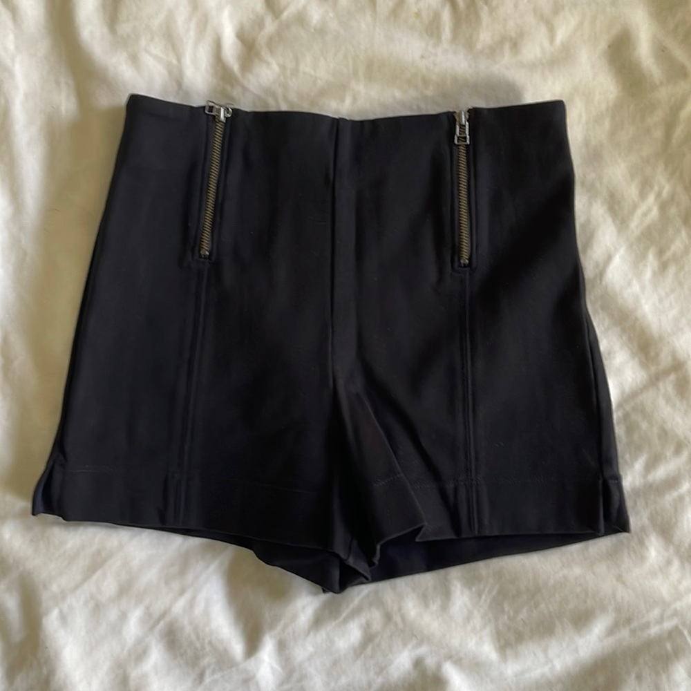High waisted stretchy black shorts. Size 4.